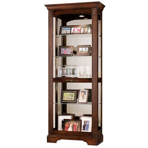 A curio cabinet is the perfect way to spruce up a drab corner in a room. Howard Miller Ricardo Curio Display Cabinet 680420