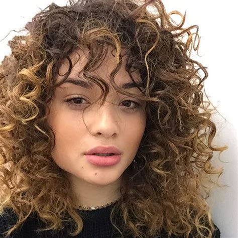 What you may not know is that ripping a comb through curly hair is not the best way to detangle it. Trend we love: the curly hair fringe | beautyheaven