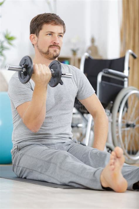 Man In Gym And Lifting Heavy Dumbbell Stock Photo Image Of Exercise