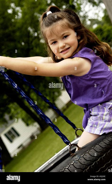Girl On Tire Swing Stock Photo Alamy