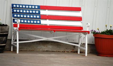 A Bench Painted Like The Flag In Front Of A Shop In Kadoka South