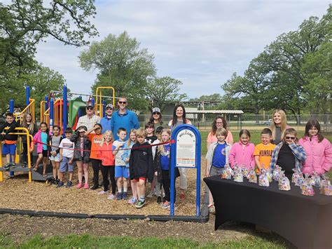 Students And Park District Officials Cut The Ribbon On A New Playground