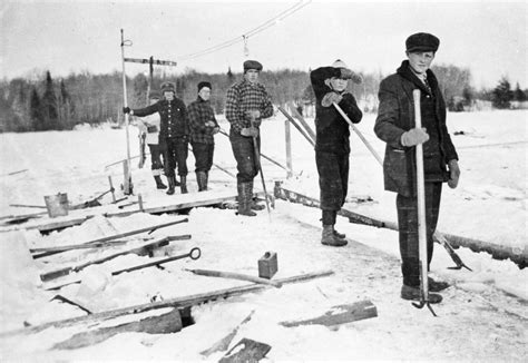 A Row Of Ice Harvesters On The Old Forge Pond