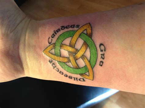 Celtic tattoo...the words in Gaelic: love, loyalty, friendship Irish