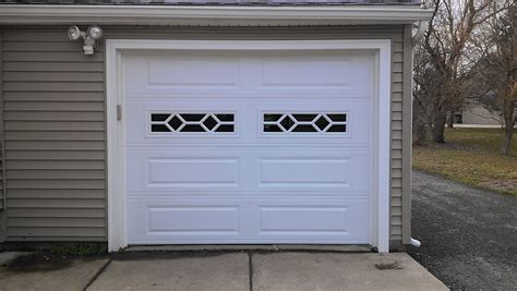 Placing your window inserts on the top row of your garage door, above eye level. Raised Long Panel | Sunrise Door & Woodworks