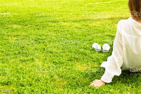 Female Bare Feet On Mawed Lawn Grass Young Woman Resting Outdoors Barefoot Take A Break Concept