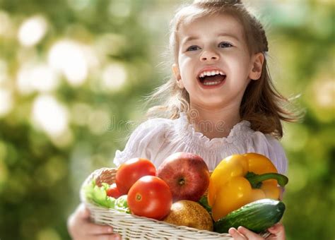 Little Girl With Basket Of Vegetables Stock Photo Image Of Diet