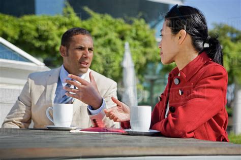 Business People Talking And Drinking Coffee Outdoors Stock Photo