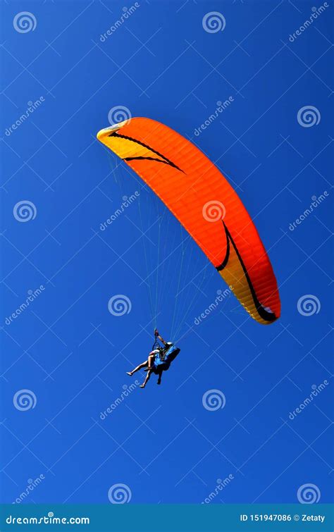 Paraglider Flight Through The Blue Sky Editorial Photo Image Of