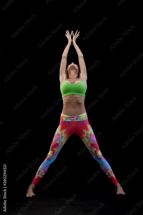 Sexy Mature Woman Stretching Up Full Body In Colorful Neon Yoga Pants