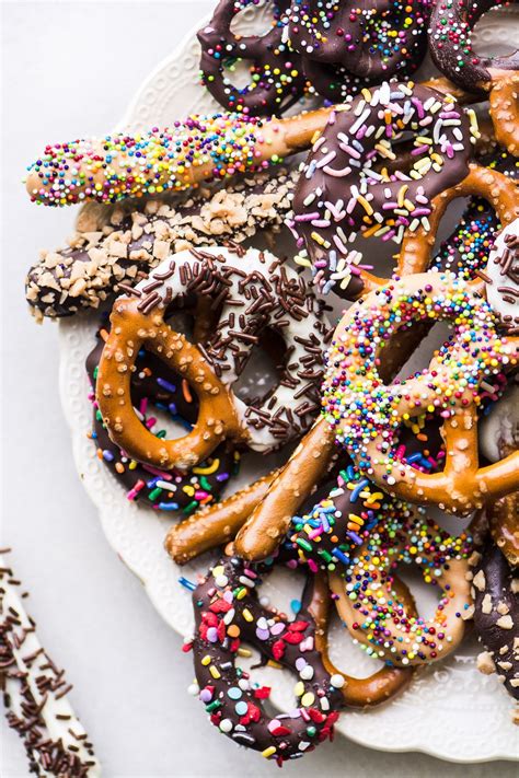 Baby blue and pink rods. chocolate covered pretzels on a white plate #dessert # ...