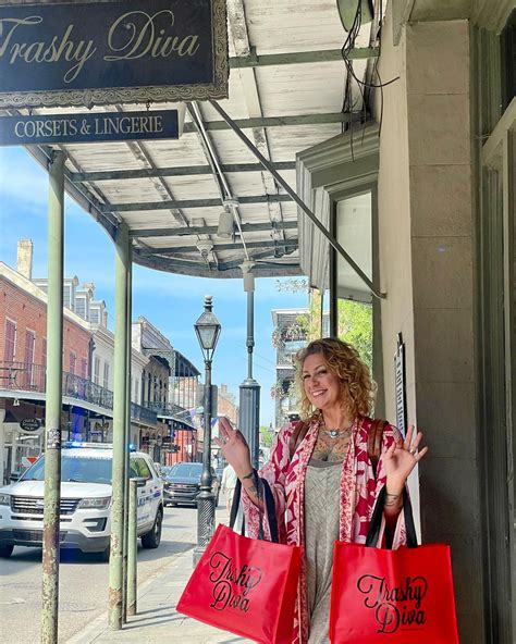 American Pickers star Danielle Colby flashes her chest tattoos in low