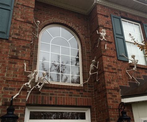 20 Climbing Skeletons On House