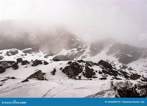 Snow Cap Mountains Covered With Low Cloud At Day Stock Photo Image Of