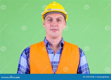 Face Of Young Man Construction Worker Looking At Camera Stock Photo