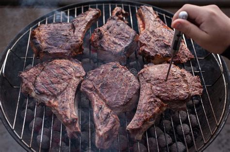 Big Beef Steaks On Bone Grilled Barbecue With Thermometer Stock Image