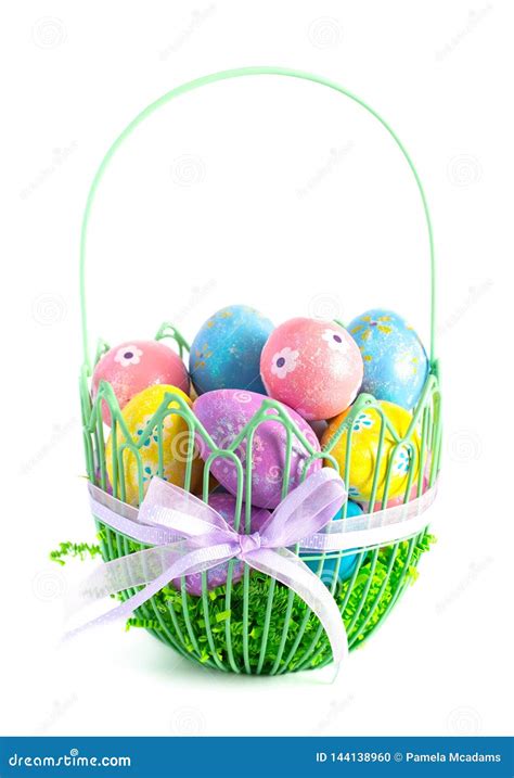 Easter Basket Filled With Decorated Eggs Isolated On A White Background