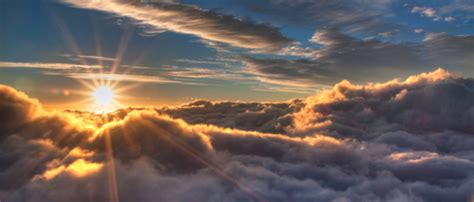 Sunrise Above The Clouds Behind The Lens Of Creating The Image