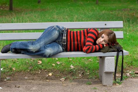 Young Girl Sleeping On A Park Bench Stock Image Colourbox