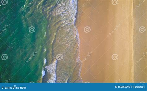 Aerial View Of Beach With Waves Rolling Into The Shore With Copy Space