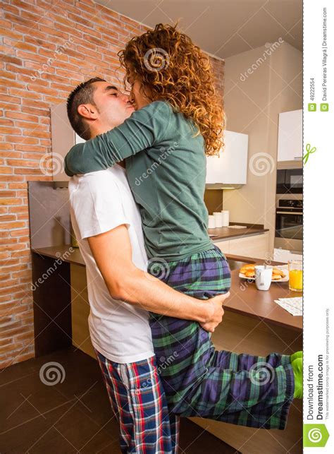 Loving Couple In A Passionate Kiss While Having Stock