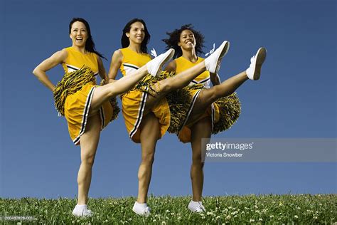 Female Cheerleaders Doing High Kicks Photo Getty Images