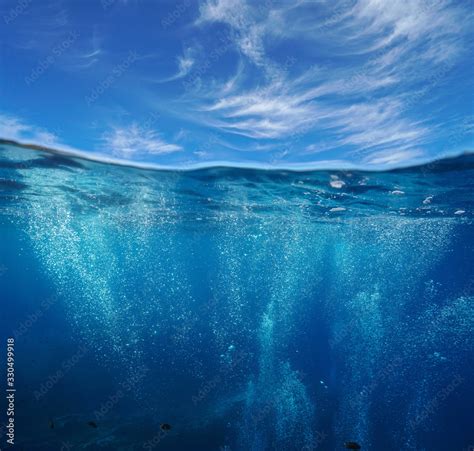 Seascape Air Bubbles Underwater Sea And Blue Sky With Cloud Split