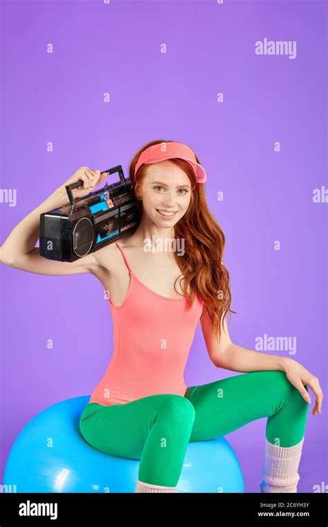 Ginger Girl Posing At Camera For Special Project Called Flashback To 80s With Portable Retro