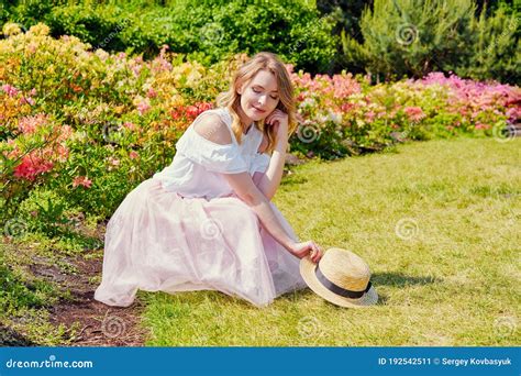 Gorgeous Young Woman Posing In A Blooming Garden Stock Image Image