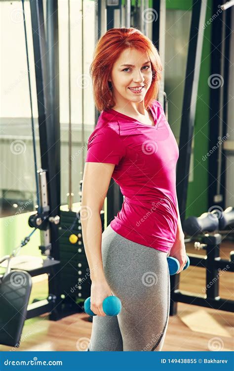 Sporty Fitness Woman With Dumbbells In Gym Trained Female Body Stock