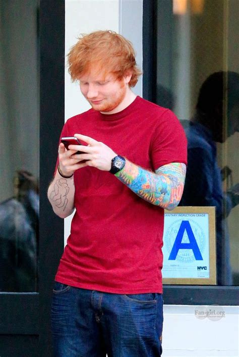 Ed Sheeran Smokes With A Friend Outside Of A Restaurant In East