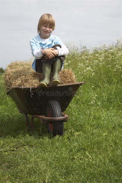 Boy Sitting Hay Wheelbarrow Field Stock Photos Free And Royalty Free