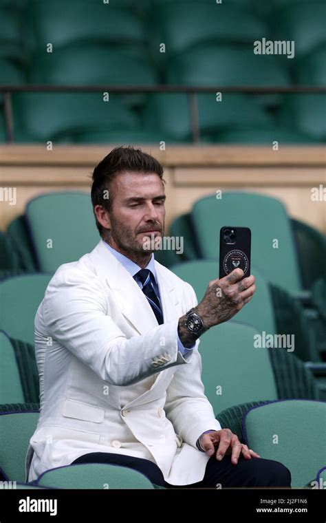 Former Footballer David Beckham Waits For A Tennis Match To Start