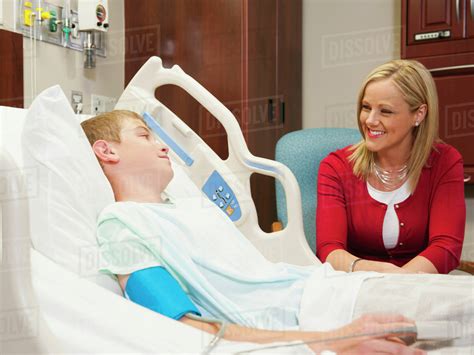 Mother Visiting Son In Hospital Stock Photo Dissolve