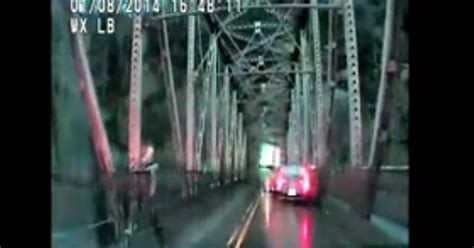 Video Woman Jumps Off Bridge In An Attempt To Flee Police Cbs News