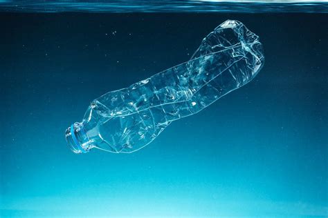 Single Use Plastic Bottle Floating In The Ocean Premium Image By