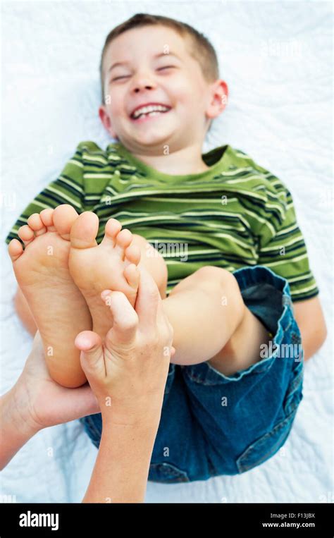 Boy Getting His Feet Tickled Stock Photo Alamy
