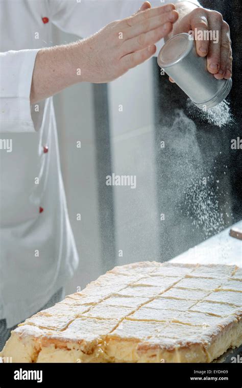 Sprinkling Powdered Sugar On Cream Slice Stock Photo Alamy