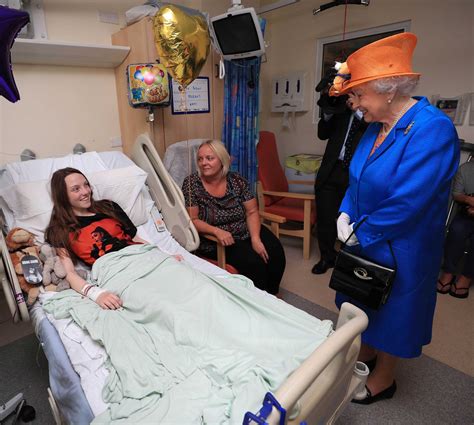 the queen surprises manchester victims with a hospital visit vogue