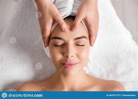 Beautiful Woman Receiving Facial Massage In Beauty Salon Closeup Top View Stock Image Image
