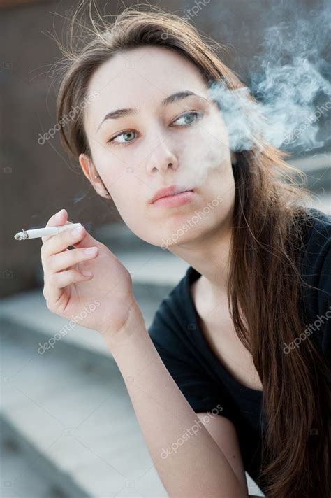 One Young Girl Smoking Cigarette — Stock Photo © Toxa