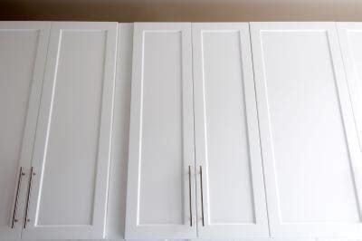 Since you're painting all parts of the cabinet door, one must be a bit creative in how one labels: How to Refinish Cabinet Doors with Plastic Veneer | eHow