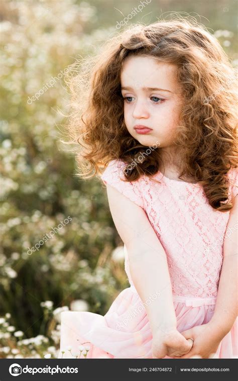 Portrait Sad Little Curly Girl Pink Long Dress Daisy Field ⬇ Stock