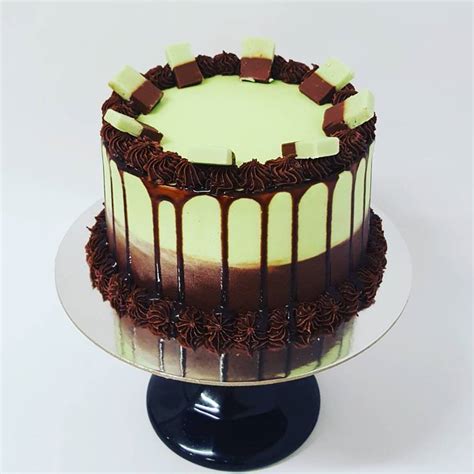 chocolate and mint drip cake topped with fudge the girl on the swing