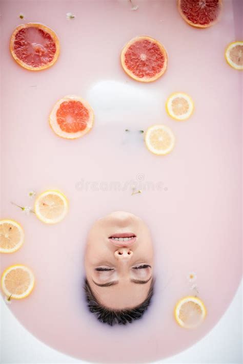 Woman Face In Milk Bath Spa Skin Care Concept Healthy Face And Rejuvenation Stock Image