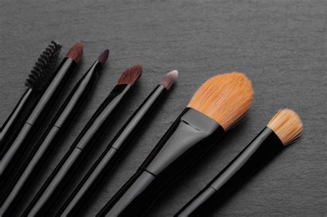 Premium Photo Makeup Brushes On Dark Background