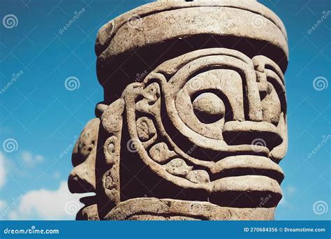 Stone Idols With Tiki Masks With Ornamentation Against Background Of Blue Sky Stock