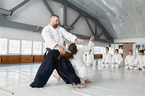 Premium Photo Aikido Sensei And Teenage Female Student Training