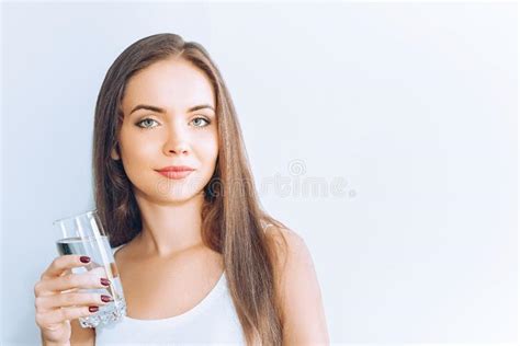 Healthy Lifestyleyoung Woman Drinking From A Glass Of Fresh Water