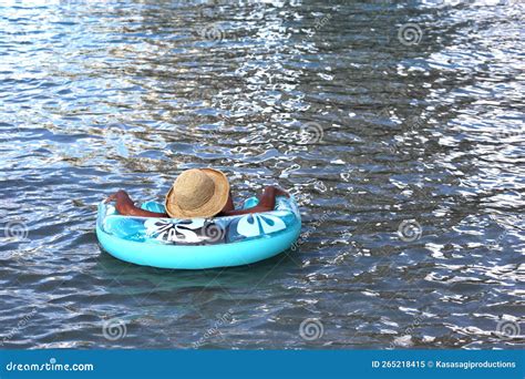 Woman Covered My Straw Sunhat Relaxing On Inflatable Tube Float On The Water Stock Image Image
